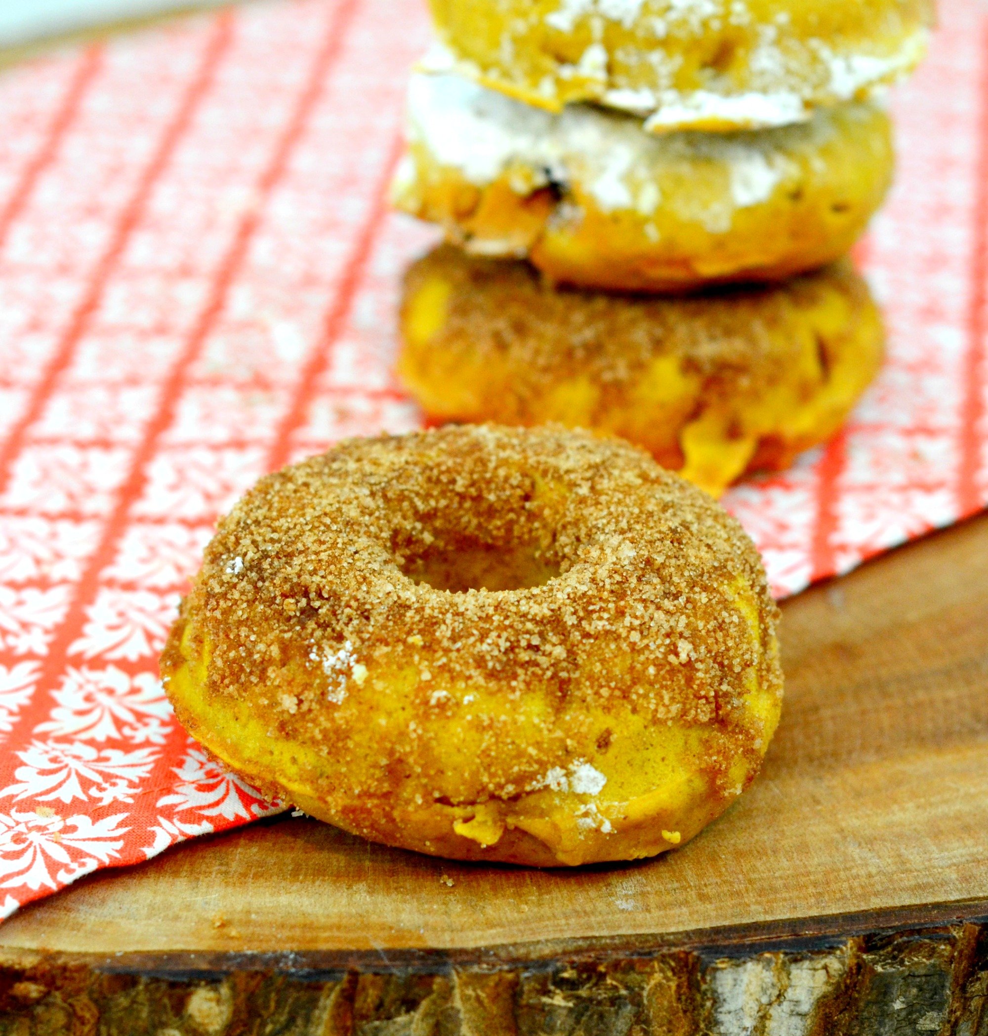 Baked Pumpkin Donuts with Cinnamon and Sugar| An easy and healthy fall breakfast. Looks like a donut and tastes like a donut but is much healthier. | www.thesurferskitchen.com