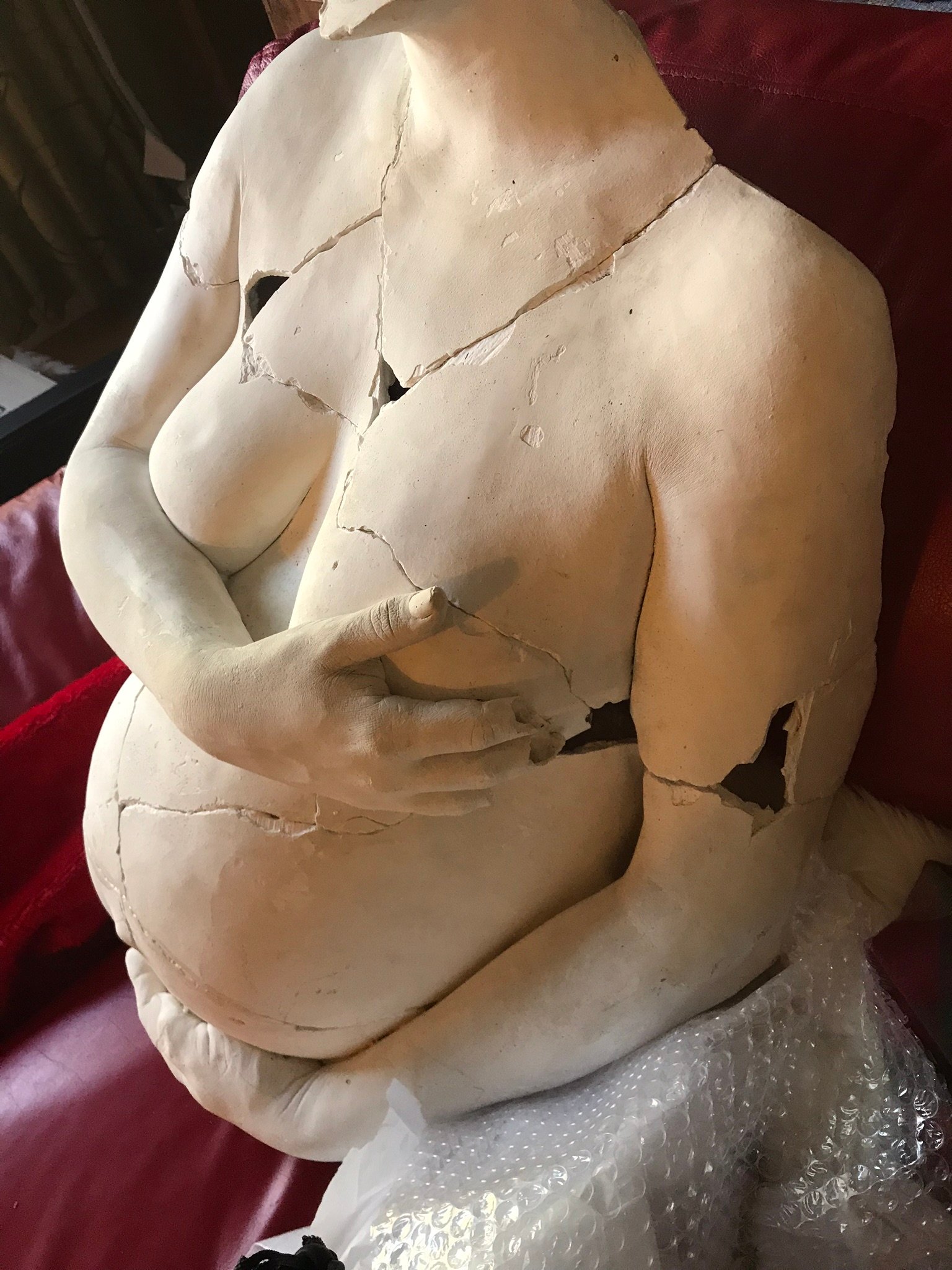 body cast of pregnant woman broken and reassembled