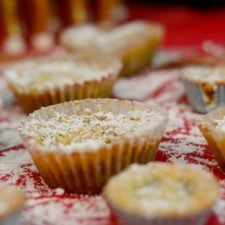 Crack Pie Cookies sprinkled with powdered sugar on red background