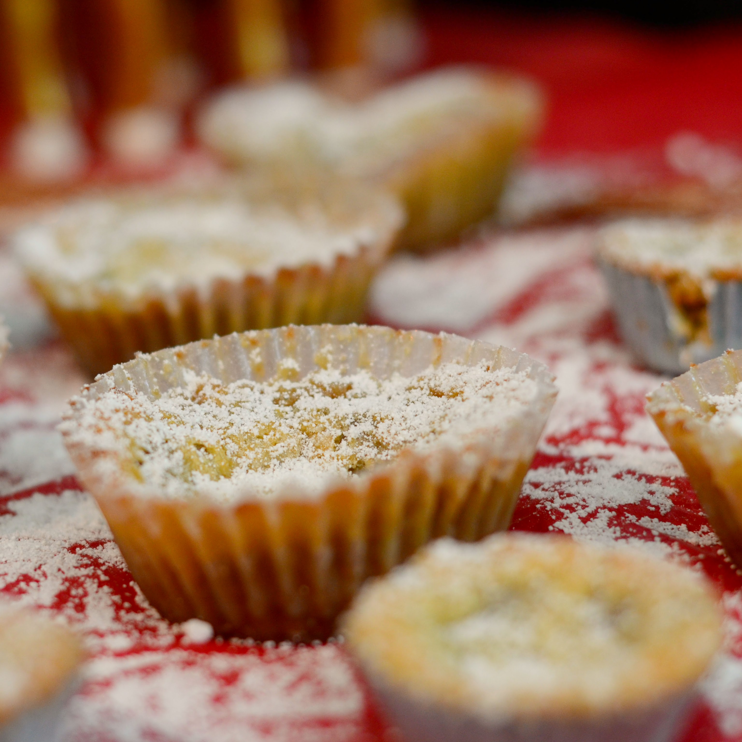 Crack Pie Cookies sprinkled with powdered sugar on red background