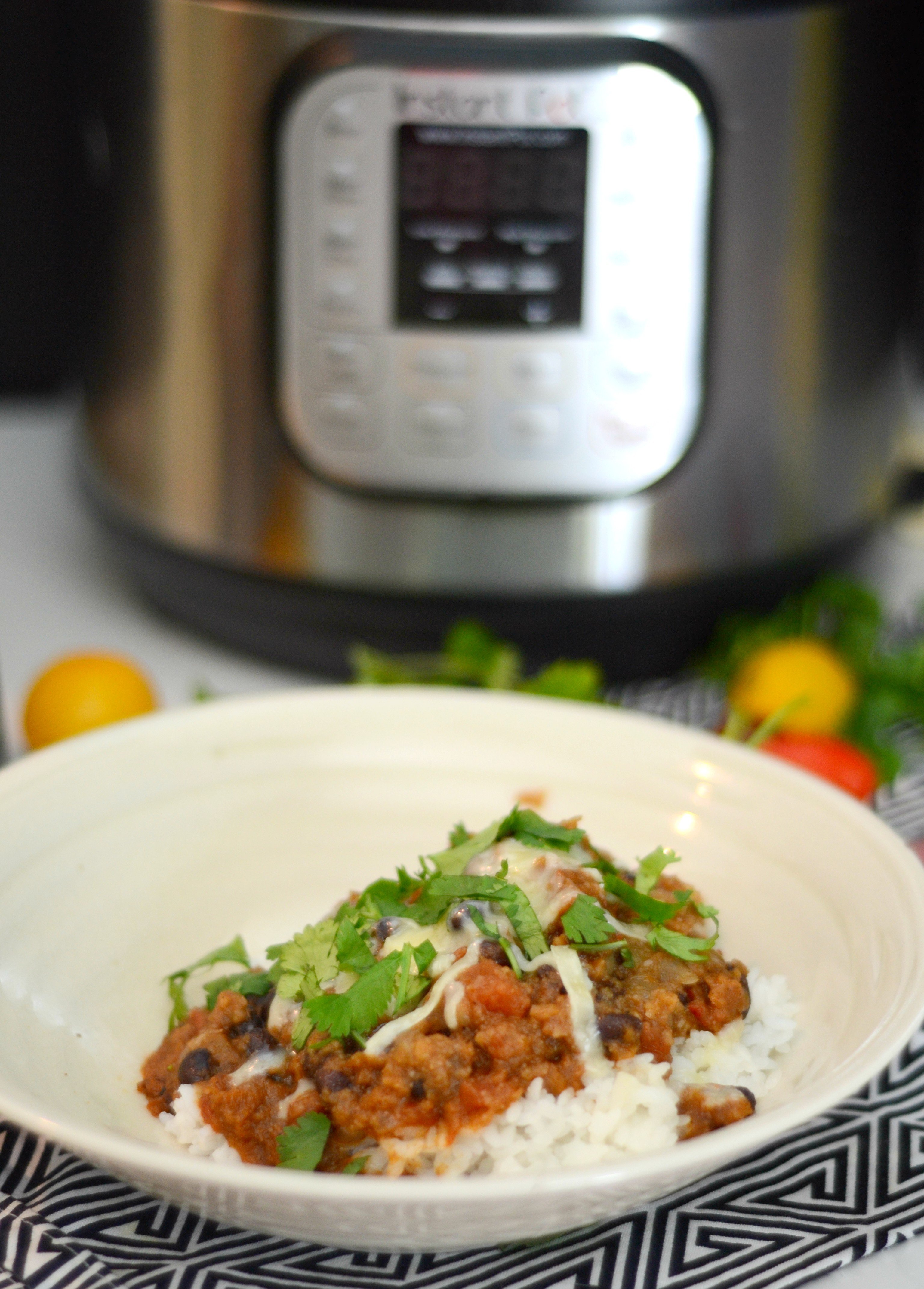 Bowl of Vegetarian Chili with Instant Pot in background