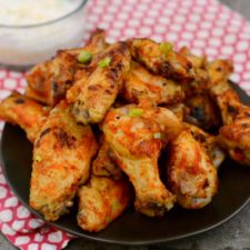 PLatter of spicy chicken wings with dipping sauce