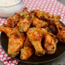 PLatter of spicy chicken wings with dipping sauce