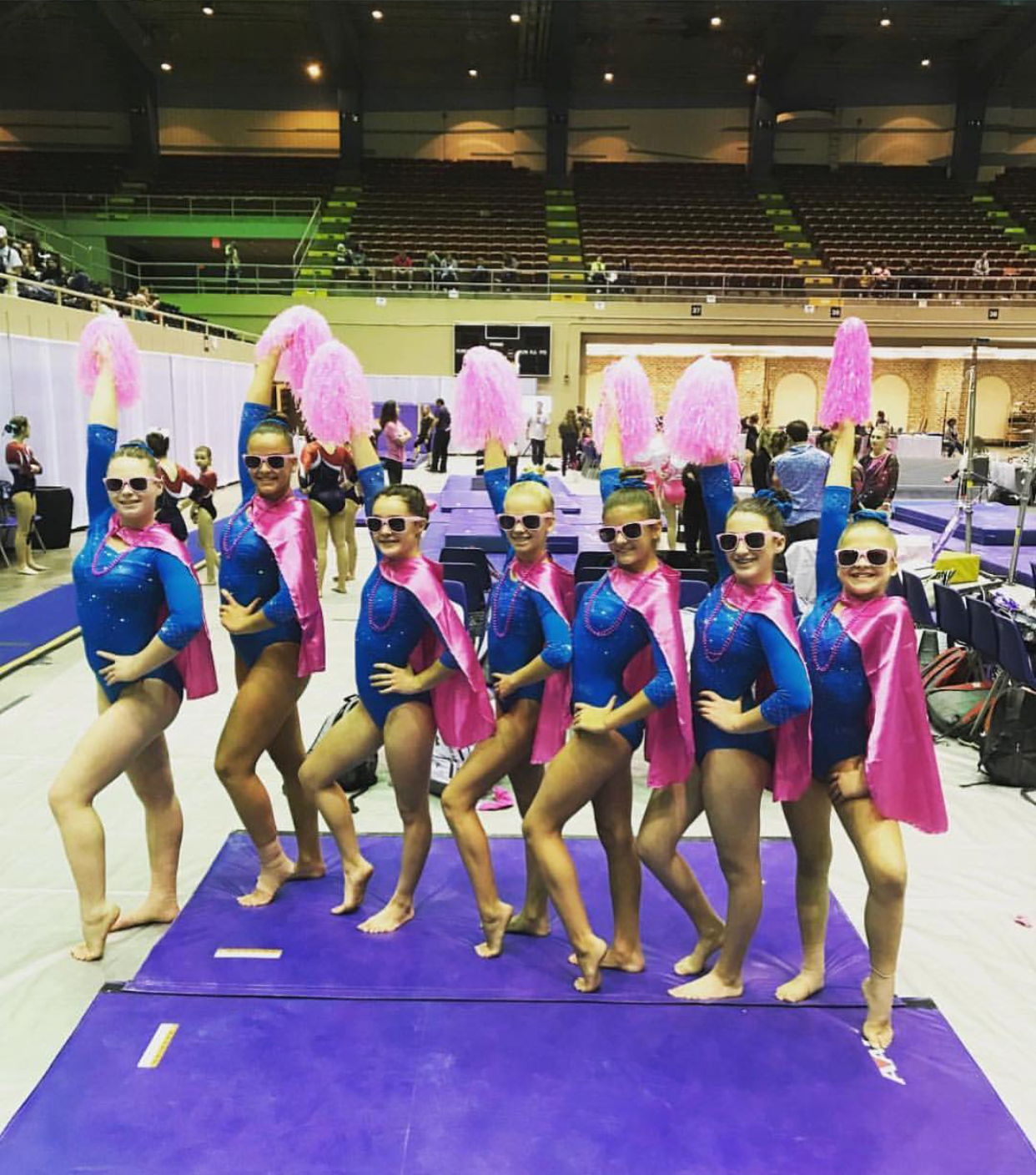 gymnasts showing team spirit at the pink meet in Savannah Georgia