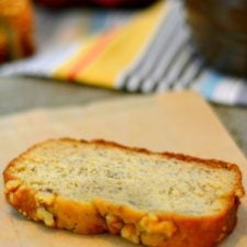 slice of banana bread topped with walnuts