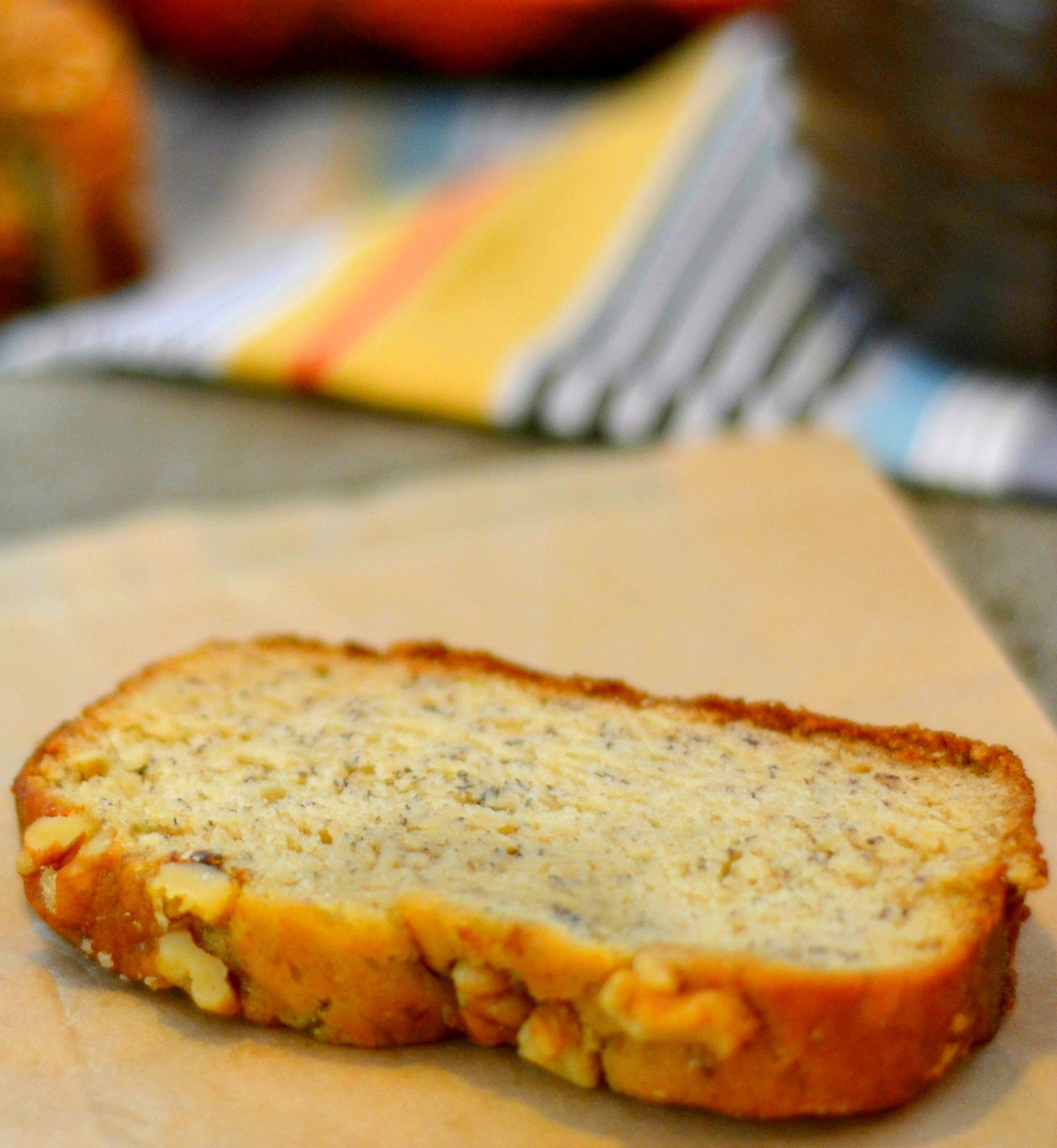 slice of banana bread topped with walnuts