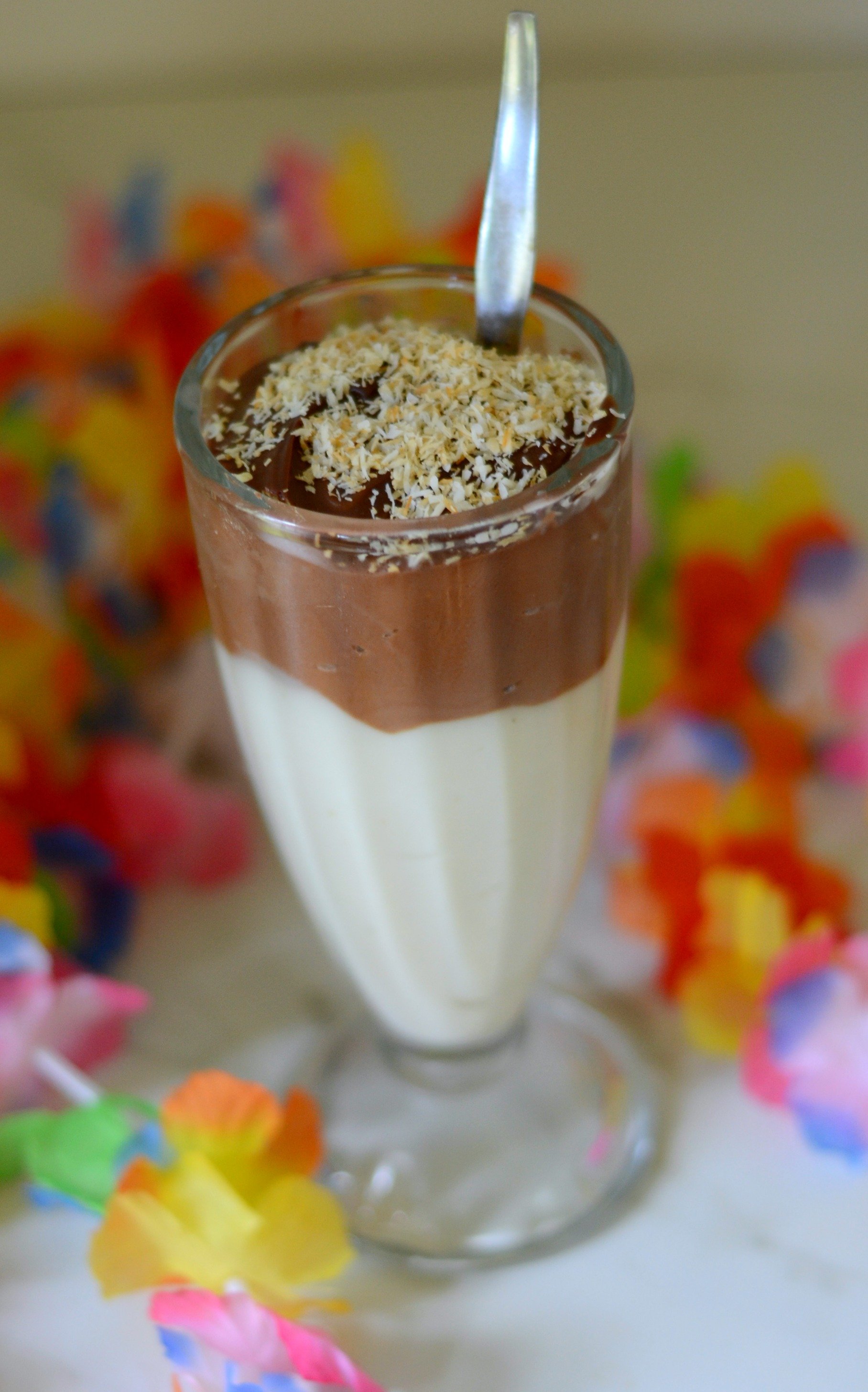 chocolate coconut pudding layered on haupia in a tall glass