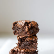 gooey brownies stacked on top of each other