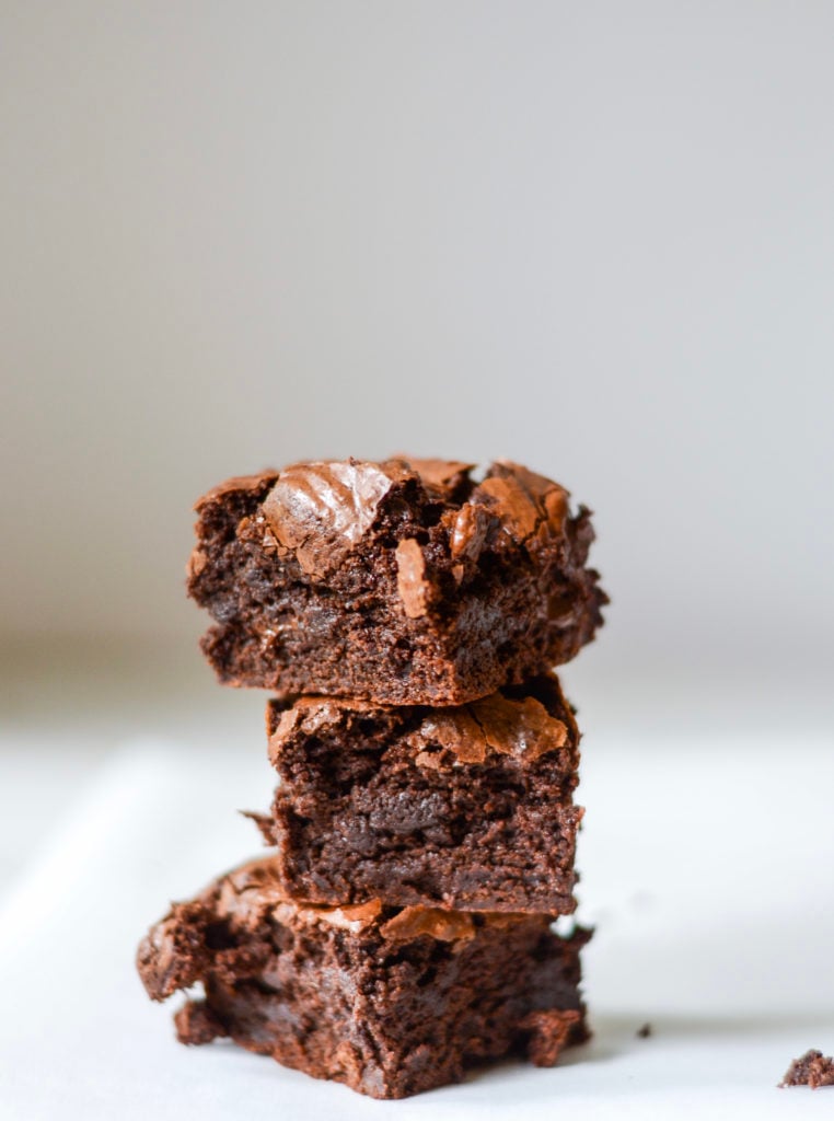 gooey brownies stacked on top of each other