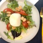 plate of greens with buratta cheese