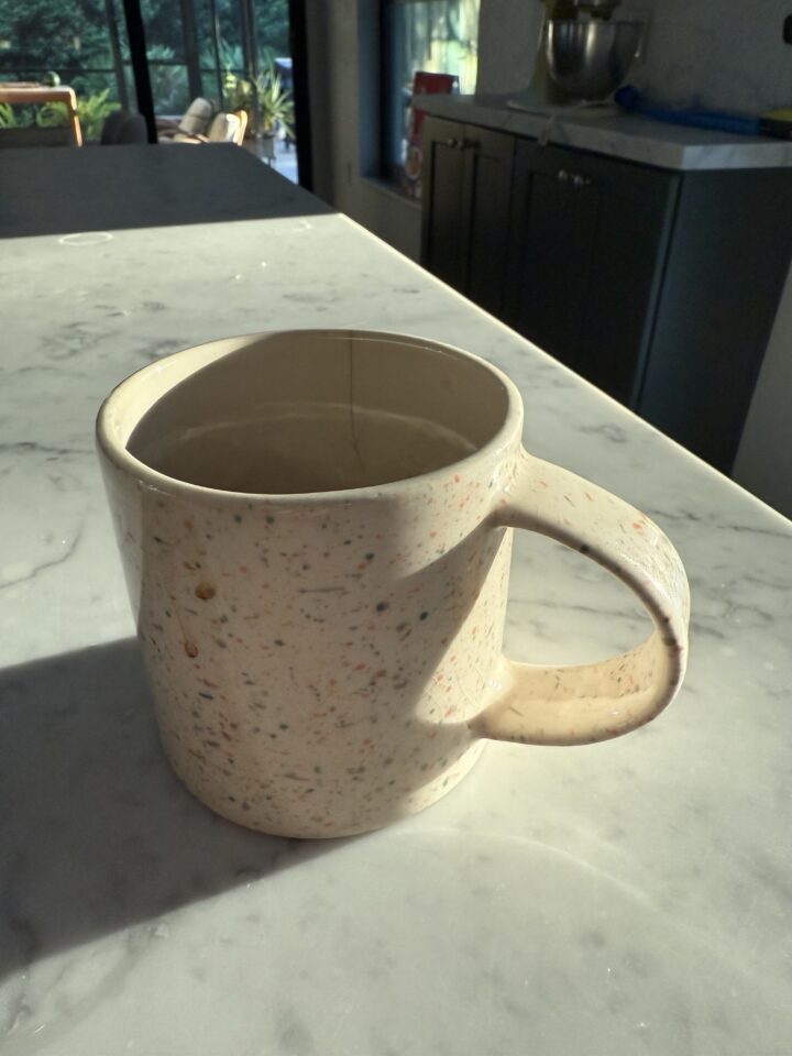 Coffee cup bathed in fall morning light